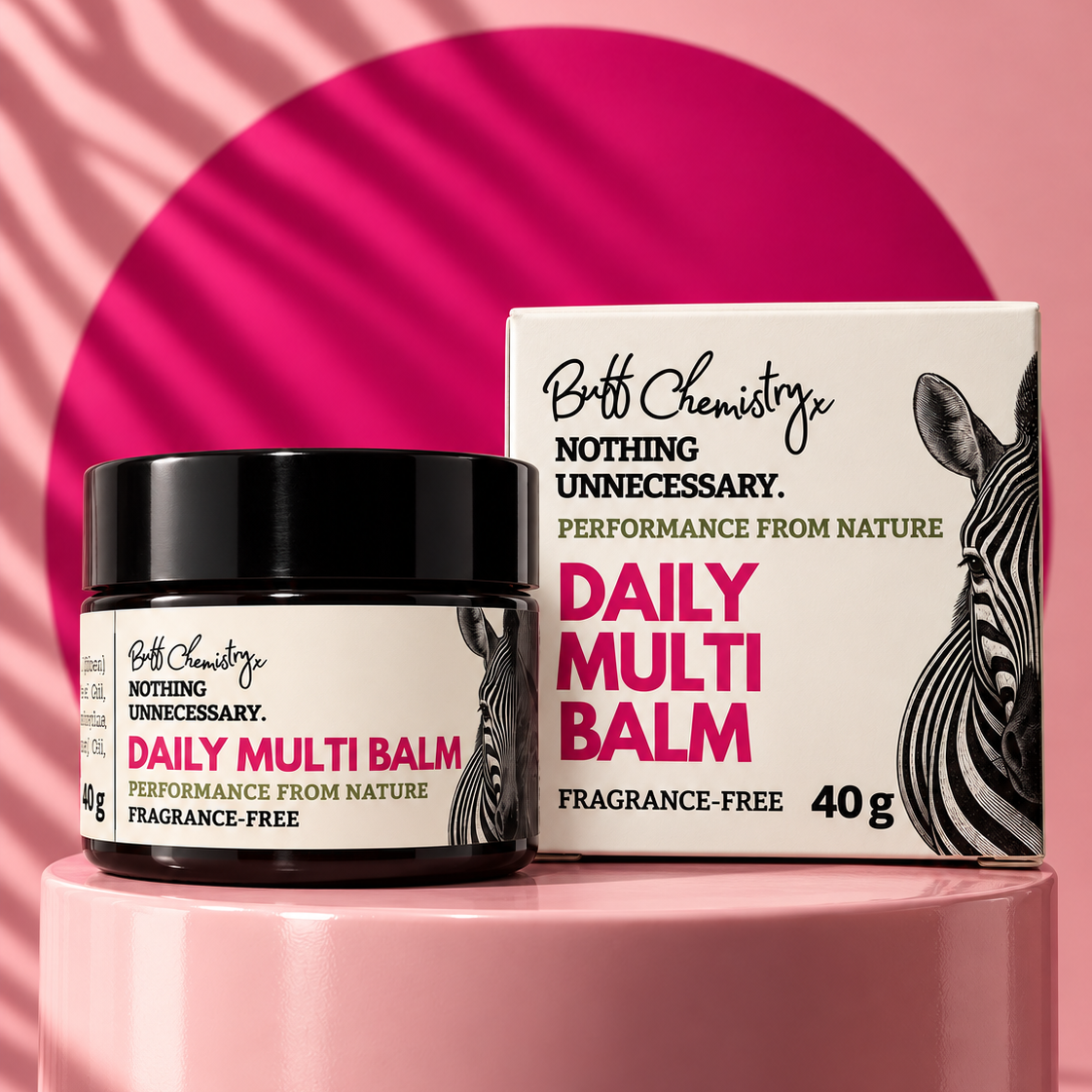 Box and amber glass jar with the labels and text 'Buff Chemistry, Nothing Unnecessary. Performance from Nature. DAILY MULTI BALM. Fragrance Free. 40g'. Image of a ZEBRA.