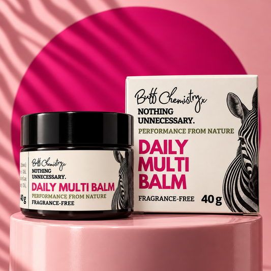 Box and amber glass jar with the labels and text 'Buff Chemistry, Nothing Unnecessary. Performance from Nature. DAILY MULTI BALM. Fragrance Free. 40g'. Image of a ZEBRA.
